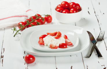 Cherry Tomatoes, Soft Cottage Cheese. White Table.