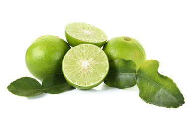 Fototapeta na wymiar green lemon and leaves isolated on white
