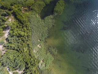 Summer time lake and green forest, in Poland lanscape. View from