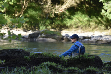 Fototapeta na wymiar Flyfisherman fishing in mountain river