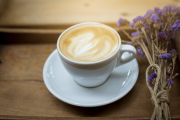 hot latte art on wood table background