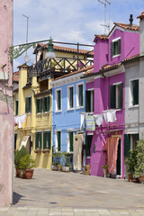 Fototapeta na wymiar Burano is an island in the Venetian Lagoon, northern Italy. Burano is known for its small, brightly painted houses,which are popular with artists. Burano is also known for its lace