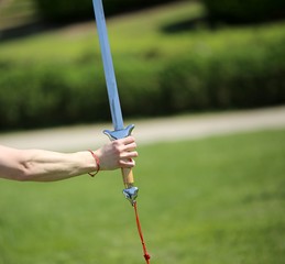 hand of the master of martial arts Tai Chi with the sword during