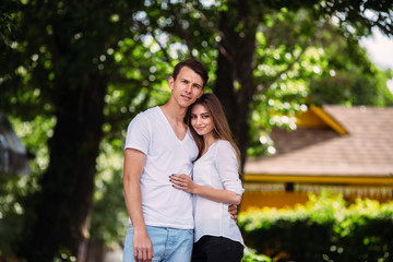 Young adult brunette man and woman in the park