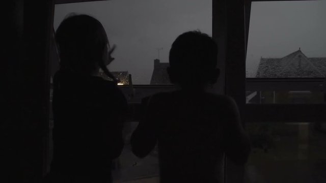 Children Watching Thunderstorms From Bedroom Window