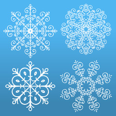 Set of 4 snowflakes on blue background.