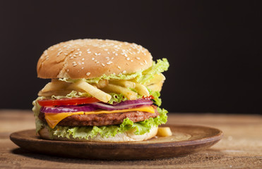 Fresh burger on wooden background
