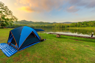 Camping Tents in Nature background with sunset scenic view at la