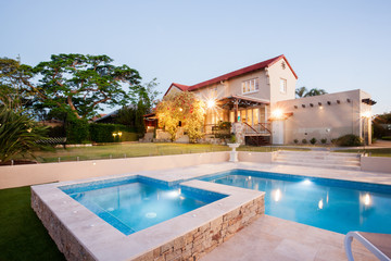 Fototapeta na wymiar Luxury house garden decoration with a pool side