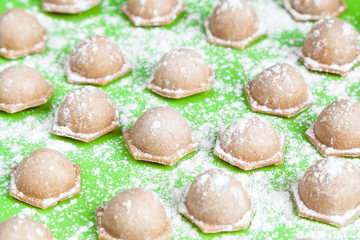 Delicious and healthy food. Homemade dumplings of coarse whole wheat flour. Shallow depth of field