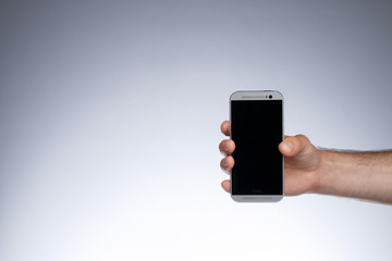 Hand holding smartphone