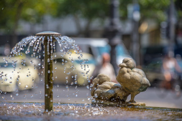 A refreshing fountain in a city in extreme heat