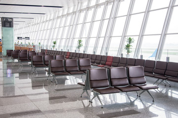 Departure lounge and chairs , waiting area to fight at the airpo