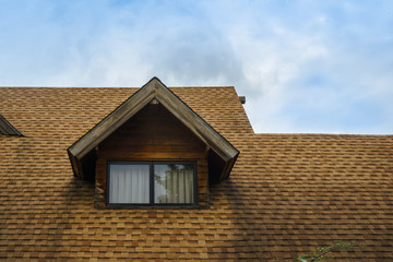 Roof and window of wooden cabin