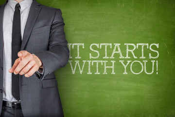 It starts with you son blackboard with businessman