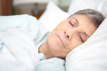 Obraz na płótnie Canvas Senior woman sleeping.