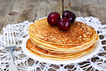 Tasty Pancakes Stack with Honey and Cherry