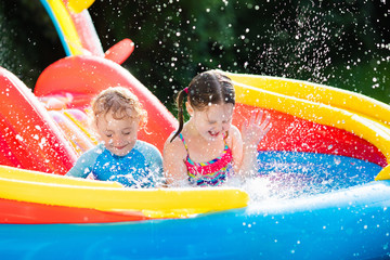 Kids playing in inflatable swimming pool