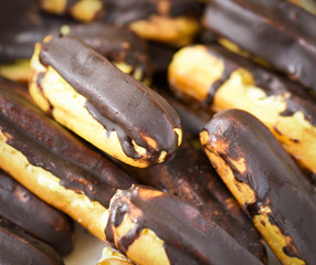 chocolate eclairs on white background