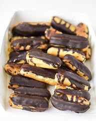 chocolate eclairs on white background