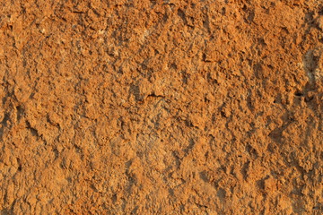 Cliff of the brown orange clay. Texture for background