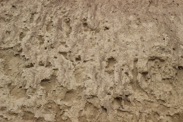 Cliff of the brown orange clay. Texture for background