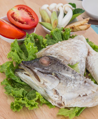 Thai food Ingredient of Tom Yum spicy Fish soup on wooden textur