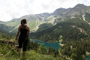 Fototapeta na wymiar Tyrolean Girl enjoys outdoor activity in the Nature