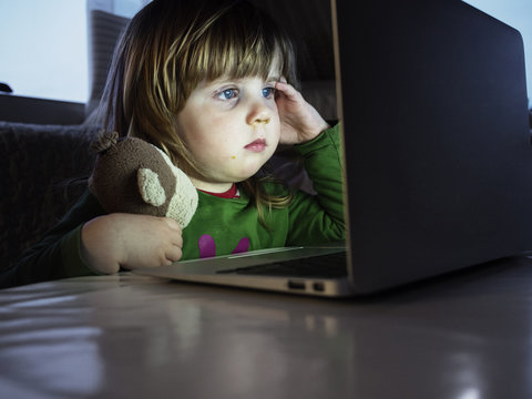 Girl looking at laptop