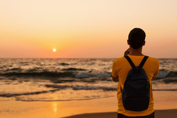 Some people relax on the sand beach