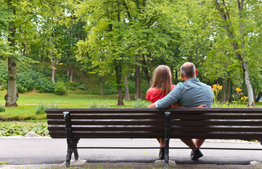 pregnant woman  with her husband in park