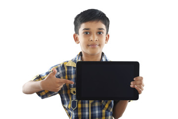 Indian boy holding tablet