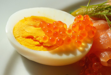 Red caviar on hard boiled egg.