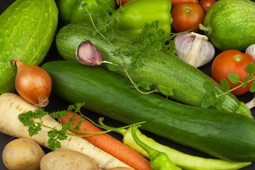 Various types of vegetables on an old wooden table. Sales of fresh vegetables. Dietary supplements for athletes.
