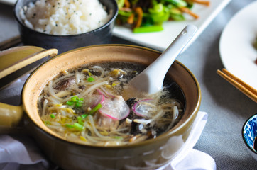 Bean sprouts soup with vegetables, meat and fish