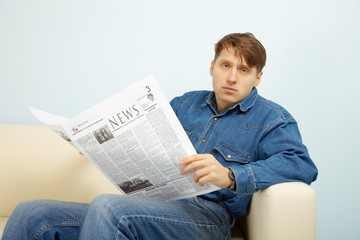 Man disappointed with news from newspaper