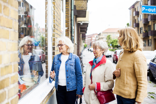 Senior women doing window shopping