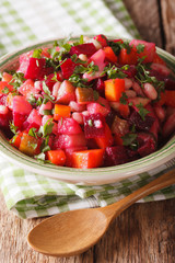 Vinaigrette Salad: beets, carrots, beans, potatoes and onions in a bowl close-up.  Vertical
