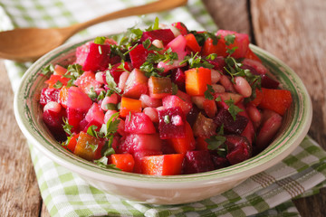 Vinaigrette Salad: beets, carrots, beans, potatoes and onions in a bowl close-up. horizontal
