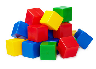 Pile of colored toy blocks on white