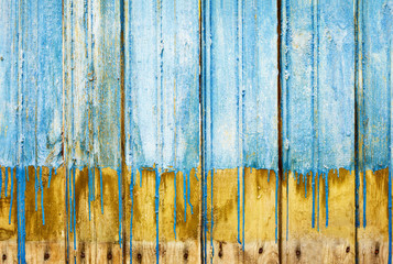 Rotten boards with old paint background