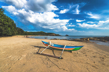 Lonely fishing boat at the Om beach in Gokarna, India