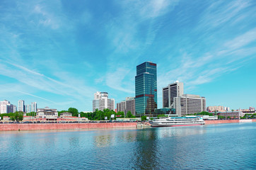 Fototapeta premium High-rise building on riverbank. Urban landscape