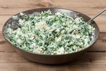 Spinach Feta Mix For Traditional Greek Vegetarian Rolls. Cooking