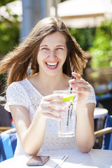 A woman relaxing with a drink