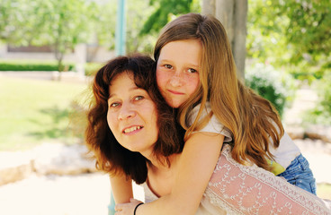 Outdoor portrait of mother and daughter