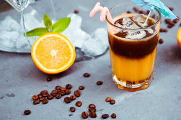 Fresh cocktail with orange, with mint and ice and coffee. Alcoholic, non-alcoholic drink-beverage