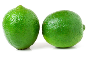 two lime isolated on white background close up