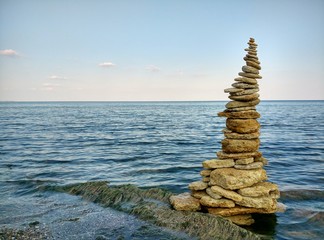 Fototapeta na wymiar Balancing stones on the beach