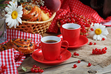 Fresh baked buns with a cup of coffee
